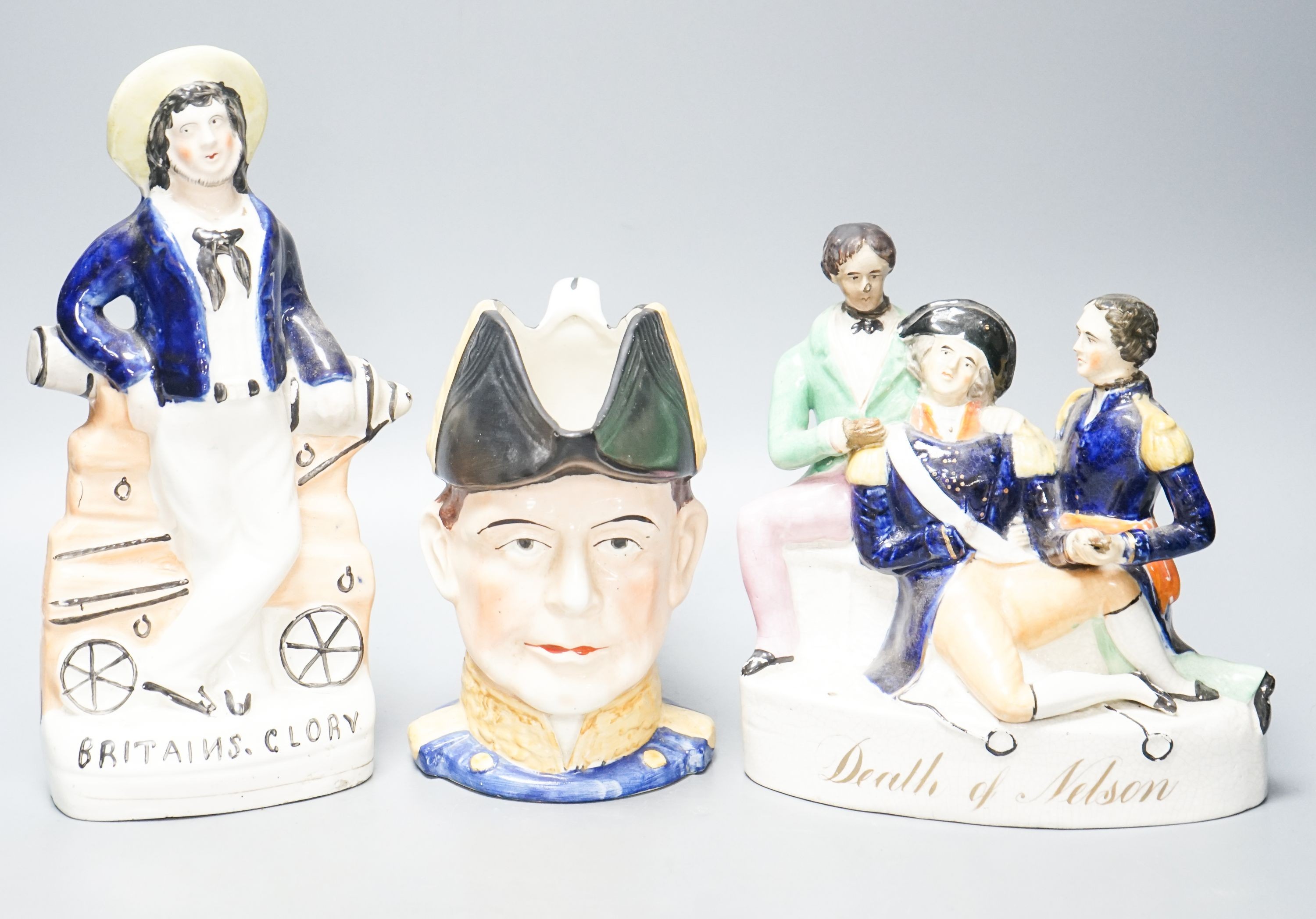A Victorian Staffordshire 'Death of Nelson' group, a 'Britain’s Glory' figure and a character jug 27cm